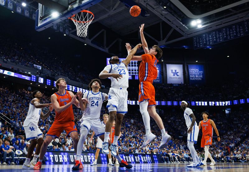 Mar 7, 2026; Lexington, Kentucky, USA; Florida Gators forward Alex Condon (21) shoots the ball against Kentucky Wildcats forward Mouhamed Dioubate (23) during the first half at Rupp Arena at Central Bank Center. Mandatory Credit: Jordan Prather-Imagn Images