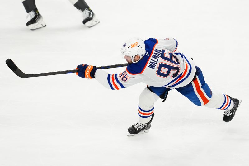 Apr 1, 2025; Las Vegas, Nevada, USA; Edmonton Oilers defenseman Jake Walman (96) shoots against the Vegas Golden Knights during the third period at T-Mobile Arena. Mandatory Credit: Stephen R. Sylvanie-Imagn Images