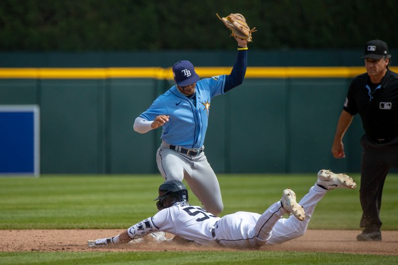 Aug 5, 2023; Detroit, Michigan, USA; Detroit Tigers second baseman Zack Short (59) slides head first into second base after hitting a double and beats the tag by Tampa Bay Rays shortstop Wander Franco (5) at Comerica Park. Mandatory Credit: David Reginek-USA TODAY Sports