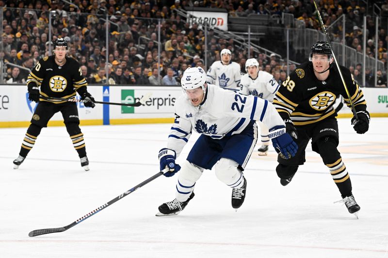 Apr 22, 2024; Boston, Massachusetts, USA; Toronto Maple Leafs defenseman Jake McCabe (22) skates for the puck against the Boston Bruins during the third period in game two of the first round of the 2024 Stanley Cup Playoffs at TD Garden. Mandatory Credit: Brian Fluharty-USA TODAY Sports