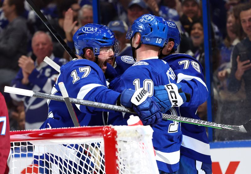 Feb 9, 2023; Tampa, Florida, USA; Tampa Bay Lightning right wing Corey Perry (10) is congratulated after he scored a goal against the Colorado Avalanche during the first period at Amalie Arena. Mandatory Credit: Kim Klement-USA TODAY Sports