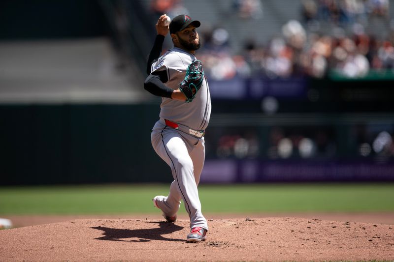 May 14, 2025; San Francisco, California, USA; Arizona Diamondbacks starting pitcher Eduardo Rodriguez (57) delivers a pitch against the San Francisco Giants during the first inning at Oracle Park. Mandatory Credit: D. Ross Cameron-Imagn Images