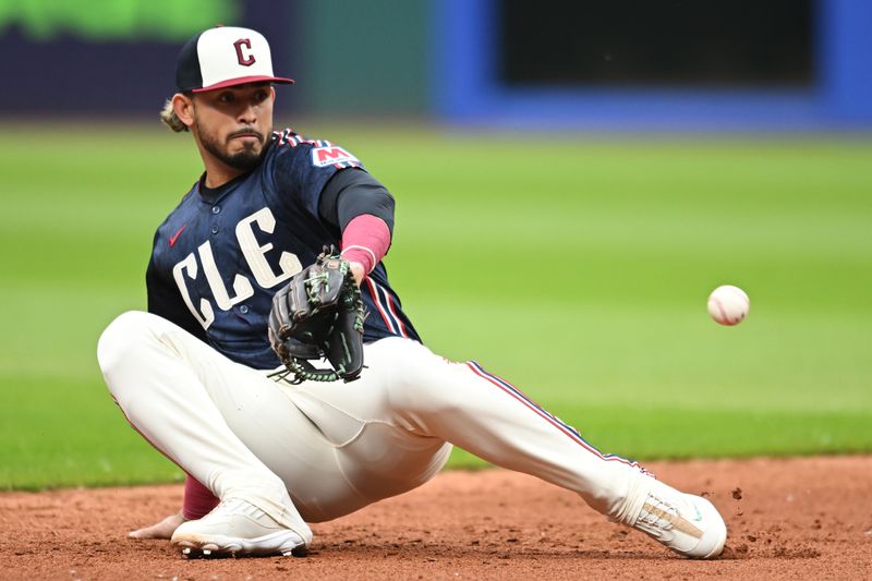 May 30, 2025; Cleveland, Ohio, USA; Cleveland Guardians shortstop Gabriel Arias (13) fails to catch a ball hit by Los Angeles Angels catcher Logan O'Hoppe (not pictured) during the second inning at Progressive Field. Mandatory Credit: Ken Blaze-Imagn Images