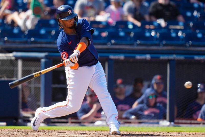 Mar 5, 2023; West Palm Beach, Florida, USA; Houston Astros catcher Martin Maldonado (15) hits a single against the Washington Nationals during the fourth inning at The Ballpark of the Palm Beaches. Mandatory Credit: Rich Storry-USA TODAY Sports