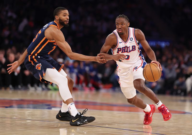 NEW YORK, NEW YORK - FEBRUARY 26: Tyrese Maxey #0 of the Philadelphia 76ers drives against Mikal Bridges #25 of the New York Knicks during their game at Madison Square Garden on February 26, 2025 in New York City. User expressly acknowledges and agrees that, by downloading and or using this photograph, User is consenting to the terms and conditions of the Getty Images License Agreement.   (Photo by Al Bello/Getty Images)