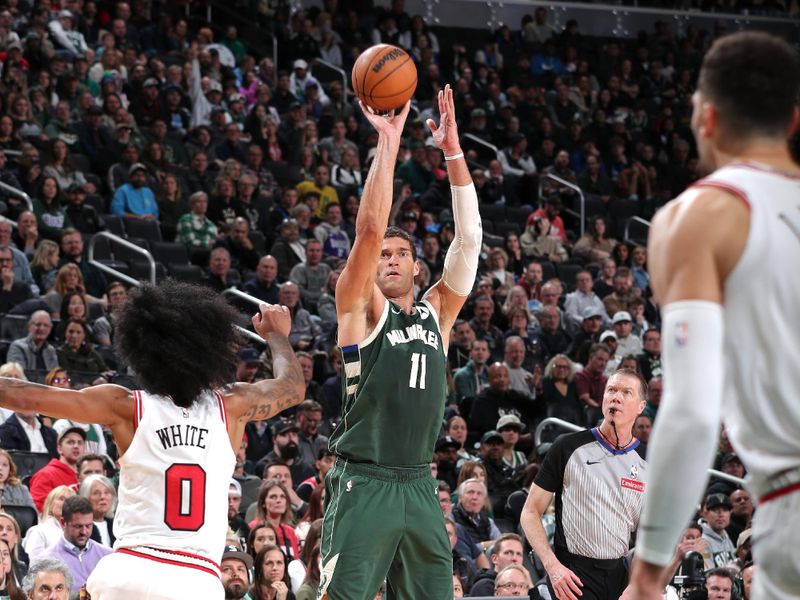 MILWAUKEE, WI - NOVEMBER 20: Brook Lopez #11 of the Milwaukee Bucks three point basket during the game against the Chicago Bulls on November 20, 2024 at the Fiserv Forum Center in Milwaukee, Wisconsin. NOTE TO USER: User expressly acknowledges and agrees that, by downloading and or using this Photograph, user is consenting to the terms and conditions of the Getty Images License Agreement. Mandatory Copyright Notice: Copyright 2024 NBAE (Photo by Gary Dineen/NBAE via Getty Images).