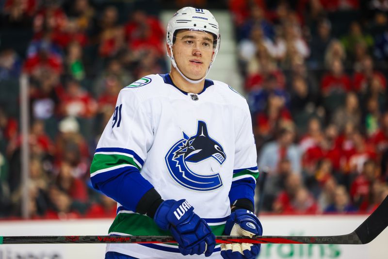 Dec 2, 2023; Calgary, Alberta, CAN; Vancouver Canucks defenseman Nikita Zadorov (91) against the Calgary Flames during the third period at Scotiabank Saddledome. Mandatory Credit: Sergei Belski-USA TODAY Sports