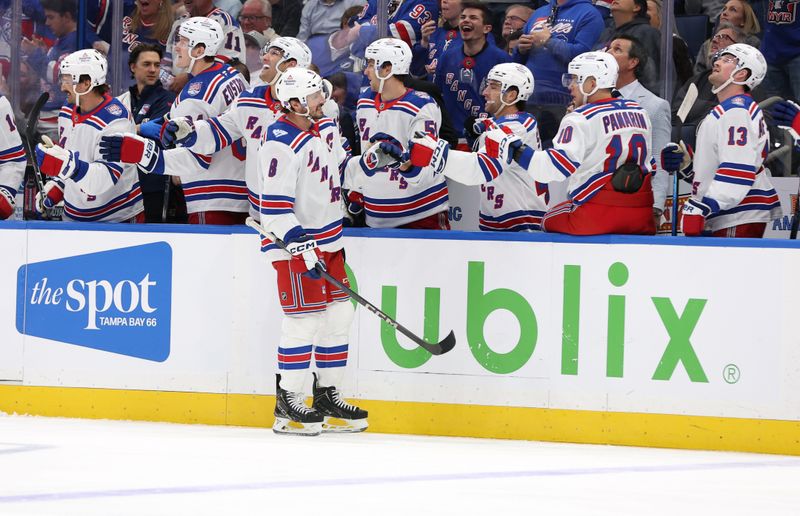 Nov 12, 2025; Tampa, Florida, USA; New York Rangers center J.T. Miller (8) is congratulated after he scored a goal against the Tampa Bay Lightning during the first period at Benchmark International Arena. Mandatory Credit: Kim Klement Neitzel-Imagn Images