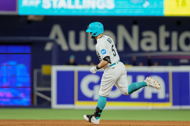 Sep 22, 2023; Miami, Florida, USA; Miami Marlins shortstop Jon Berti (5) circles the bases after hitting a home run against the Milwaukee Brewers during the eighth inning at loanDepot Park. Mandatory Credit: Sam Navarro-USA TODAY Sports