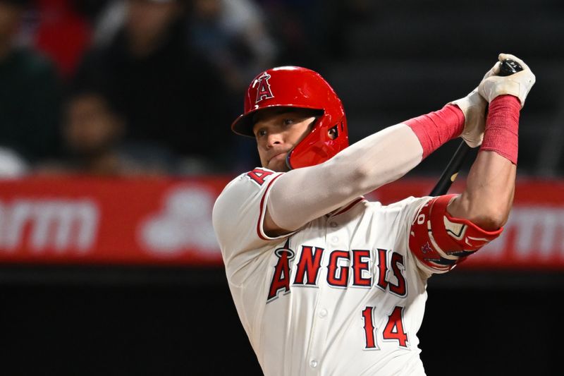 May 11, 2024; Anaheim, California, USA; Los Angeles Angels catcher Logan O'Hoppe (14) hits a two run double against the Kansas City Royals during the seventh inning at Angel Stadium. Mandatory Credit: Jonathan Hui-USA TODAY Sports