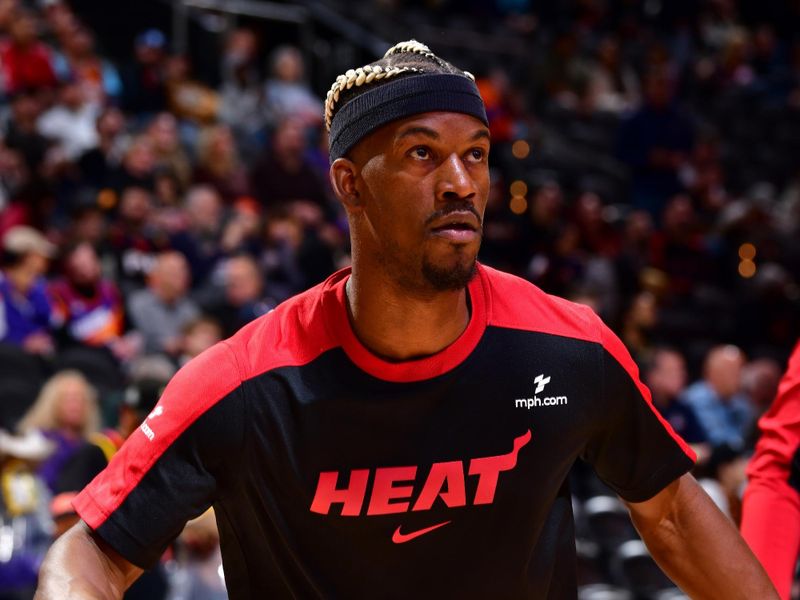 PHOENIX, AZ - NOVEMBER 6: Jimmy Butler #22 of the Miami Heat looks on before the game against the Phoenix Suns on November 6, 2024 at Footprint Center in Phoenix, Arizona. NOTE TO USER: User expressly acknowledges and agrees that, by downloading and or using this photograph, user is consenting to the terms and conditions of the Getty Images License Agreement. Mandatory Copyright Notice: Copyright 2024 NBAE (Photo by Barry Gossage/NBAE via Getty Images)