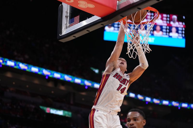 MIAMI, FL - OCTOBER 13:  Tyler Herro #14 of the Miami Heat dunks the ball during the game against the New Orleans Pelicans during a preseason game on October 13, 2024 at Kaseya Center in Miami, Florida. NOTE TO USER: User expressly acknowledges and agrees that, by downloading and or using this Photograph, user is consenting to the terms and conditions of the Getty Images License Agreement. Mandatory Copyright Notice: Copyright 2024 NBAE (Photo by Eric Espada/NBAE via Getty Images)