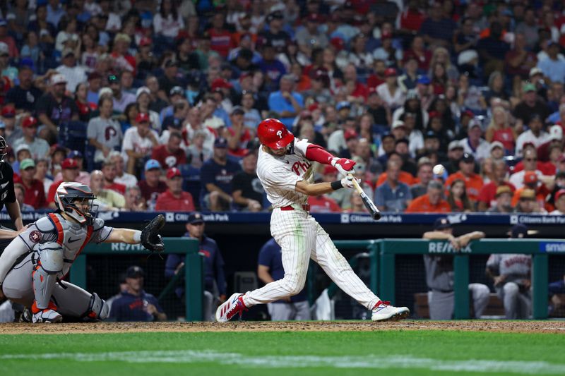 Aug 27, 2024; Philadelphia, Pennsylvania, USA; Philadelphia Phillies shortstop Trea Turner (7) hits a single during the seventh inning against the Houston Astros at Citizens Bank Park. Mandatory Credit: Bill Streicher-USA TODAY Sports