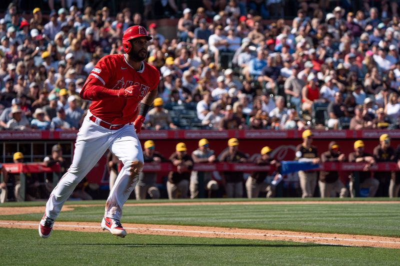 Mar 10, 2024; Tempe, Arizona, USA; Los Angeles Angels outfielder Aaron Hicks (12) doubles on a line drive to right in the sixth during a spring training game against the San Diego Padres at Tempe Diablo Stadium. Mandatory Credit: Allan Henry-USA TODAY Sports