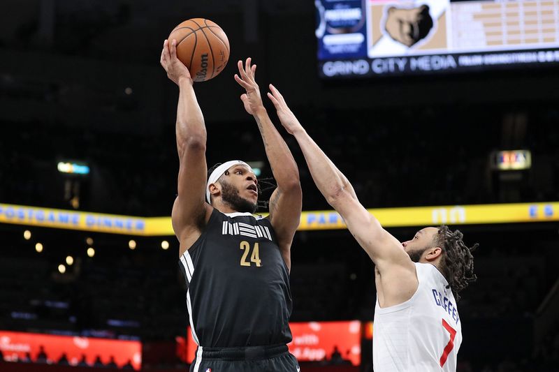 MEMPHIS, TENNESSEE - FEBRUARY 23: Lamar Stevens #24 of the Memphis Grizzlies shoots against Amir Coffey #7 of the LA Clippers during the second half at FedExForum on February 23, 2024 in Memphis, Tennessee. NOTE TO USER: User expressly acknowledges and agrees that, by downloading and or using this photograph, User is consenting to the terms and conditions of the Getty Images License Agreement. (Photo by Justin Ford/Getty Images)