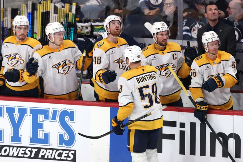 Oct 18, 2025; Winnipeg, Manitoba, CAN; Nashville Predators left wing Michael Bunting (58) celebrates his goal against the Winnipeg Jets during the third period at Canada Life Centre. Mandatory Credit: James Carey Lauder-Imagn Images