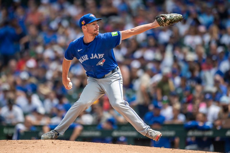 Aug 17, 2024; Chicago, Illinois, USA; Toronto Blue Jays starting pitcher Chris Bassitt (40) pitches during the first inning against the Chicago Cubs at Wrigley Field. Mandatory Credit: Patrick Gorski-USA TODAY Sports