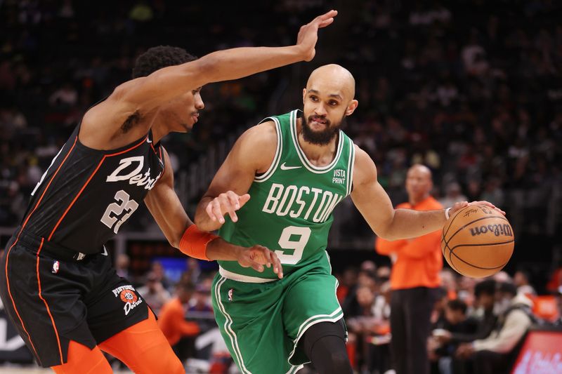 DETROIT, MICHIGAN - MARCH 22: Derrick White #9 of the Boston Celtics drives around Jaden Ivey #23 of the Detroit Pistons during the first half at Little Caesars Arena on March 22, 2024 in Detroit, Michigan. NOTE TO USER: User expressly acknowledges and agrees that, by downloading and or using this photograph, User is consenting to the terms and conditions of the Getty Images License. (Photo by Gregory Shamus/Getty Images)