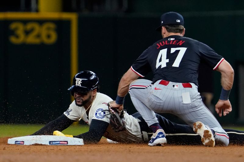 Aug 16, 2024; Arlington, Texas, USA; Texas Rangers outfielder Leody Taveras (3) is caught stealing as Minnesota Twins second baseman Edouard Julien (47) applies the tag during the seventh inning at Globe Life Field. Mandatory Credit: Raymond Carlin III-USA TODAY Sports