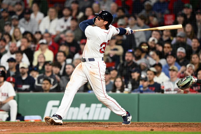 Apr 23, 2025; Boston, Massachusetts, USA; Boston Red Sox first base Triston Casas (36) hits a three-run home run against the Seattle Mariners during the eighth inning at Fenway Park. Mandatory Credit: Brian Fluharty-Imagn Images