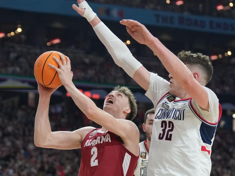 Apr 6, 2024; Glendale, AZ, USA; Alabama Crimson Tide forward Grant Nelson (2) shoots against Connecticut Huskies center Donovan Clingan (32) in the semifinals of the men's Final Four of the 2024 NCAA Tournament at State Farm Stadium. Mandatory Credit: Robert Deutsch-USA TODAY Sports