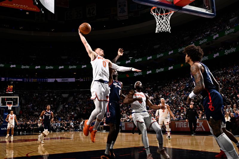 PHILADELPHIA, PA - FEBRUARY 22: Donte Divincenzo #0 of the New York Knicks drives to the basket during the game against the Philadelphia 76ers on February 22, 2024 at the Wells Fargo Center in Philadelphia, Pennsylvania NOTE TO USER: User expressly acknowledges and agrees that, by downloading and/or using this Photograph, user is consenting to the terms and conditions of the Getty Images License Agreement. Mandatory Copyright Notice: Copyright 2024 NBAE (Photo by David Dow/NBAE via Getty Images)