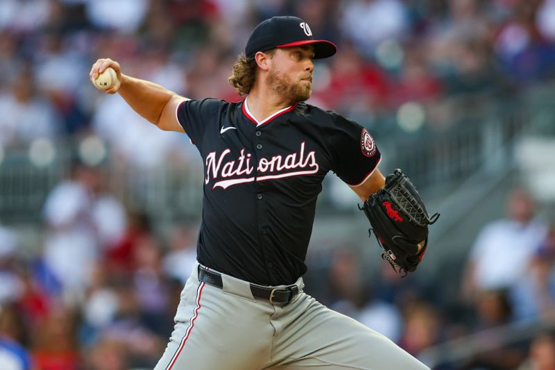 Aug 24, 2024; Atlanta, Georgia, USA; Washington Nationals starting pitcher Jake Irvin (27) throws against the Atlanta Braves in the first inning at Truist Park. Mandatory Credit: Brett Davis-USA TODAY Sports