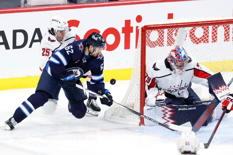 Mar 11, 2024; Winnipeg, Manitoba, CAN; Winnipeg Jets right wing Nino Niederreiter (62) tries wrap around on Washington Capitals goaltender Charlie Lindgren (79) in the third period at Canada Life Centre. Mandatory Credit: James Carey Lauder-USA TODAY Sports