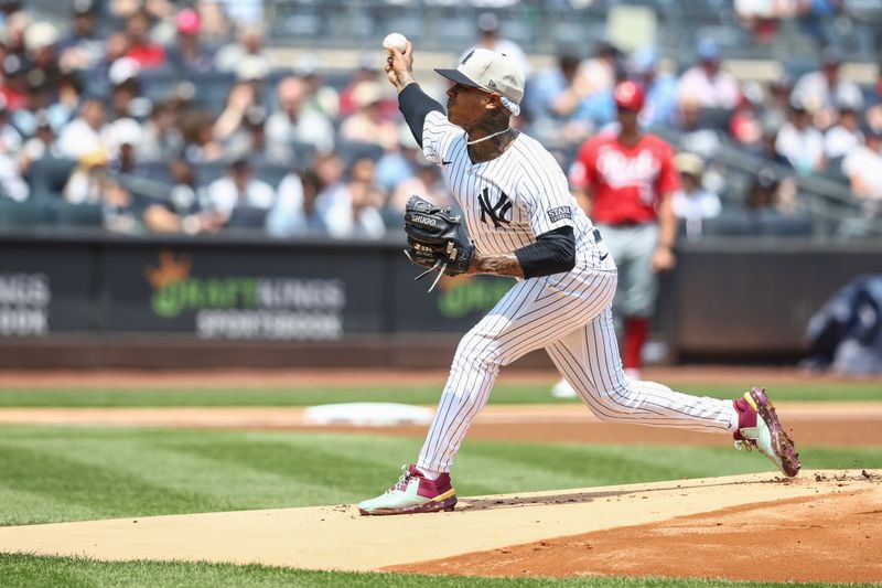 Jul 4, 2024; Bronx, New York, USA; New York Yankees starting pitcher Marcus Stroman (0) pitches in the first inning against the Cincinnati Reds at Yankee Stadium. Mandatory Credit: Wendell Cruz-USA TODAY Sports
