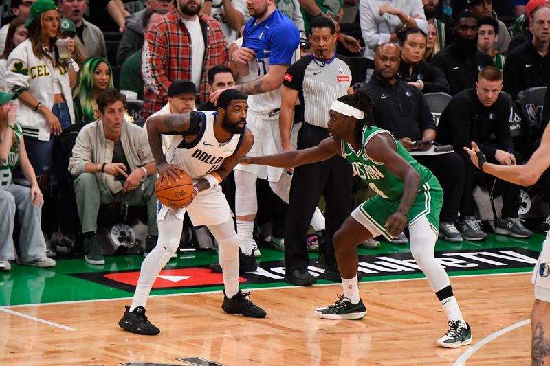 BOSTON, MA - JUNE 17: Kyrie Irving #11 of the Dallas Mavericks handles the ball during the game against the Boston Celtics during Game 5 of the 2024 NBA Finals on June 17, 2024 at the TD Garden in Boston, Massachusetts. NOTE TO USER: User expressly acknowledges and agrees that, by downloading and or using this photograph, User is consenting to the terms and conditions of the Getty Images License Agreement. Mandatory Copyright Notice: Copyright 2024 NBAE  (Photo by Brian Babineau/NBAE via Getty Images)