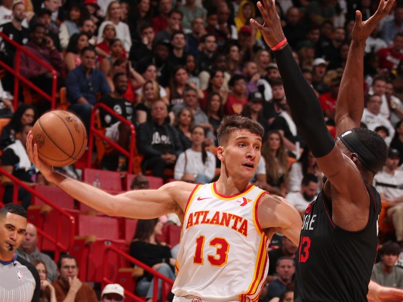 MIAMI, FL - JANUARY 19: Bogdan Bogdanovic #13 of the Atlanta Hawks passes the ball during the game against the Miami Heat on January 19, 2024 at Kaseya Center in Miami, Florida. NOTE TO USER: User expressly acknowledges and agrees that, by downloading and or using this Photograph, user is consenting to the terms and conditions of the Getty Images License Agreement. Mandatory Copyright Notice: Copyright 2024 NBAE (Photo by Issac Baldizon/NBAE via Getty Images)