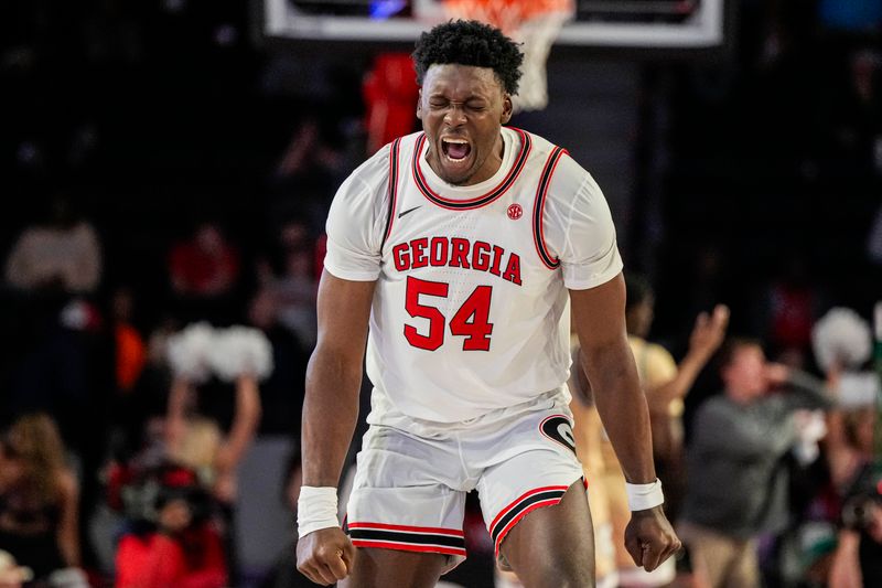 Dec 5, 2023; Athens, Georgia, USA; Georgia Bulldogs center Russel Tchewa (54) reacts after a Georgia basket against the Georgia Tech Yellow Jackets during the second half at Stegeman Coliseum. Mandatory Credit: Dale Zanine-USA TODAY Sports