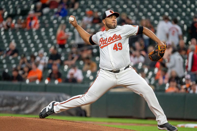 Sep 17, 2024; Baltimore, Maryland, USA;  Baltimore Orioles pitcher Albert Suárez (49) throws a first inning pitch against the San Francisco Giants at Oriole Park at Camden Yards. Mandatory Credit: Tommy Gilligan-Imagn Images