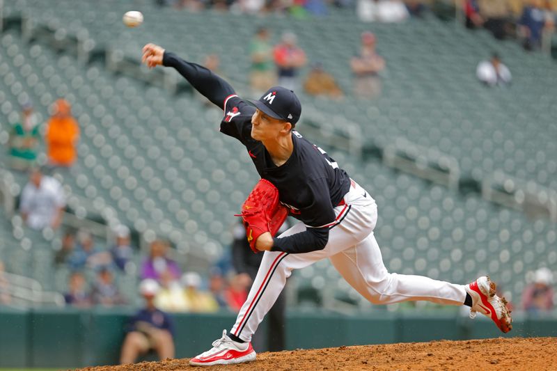 Jun 20, 2024; Minneapolis, Minnesota, USA; Minnesota Twins relief pitcher Griffin Jax (22) throws to the Tampa Bay Rays in the tenth inning at Target Field. Mandatory Credit: Bruce Kluckhohn-USA TODAY Sports