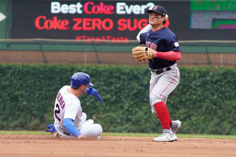 Jul 16, 2023; Chicago, Illinois, USA; Boston Red Sox shortstop Yu Chang (20) forces out Chicago Cubs shortstop Nico Hoerner (2) at second base then throws to first base to complete a double play during the first inning at Wrigley Field. Mandatory Credit: David Banks-USA TODAY Sports