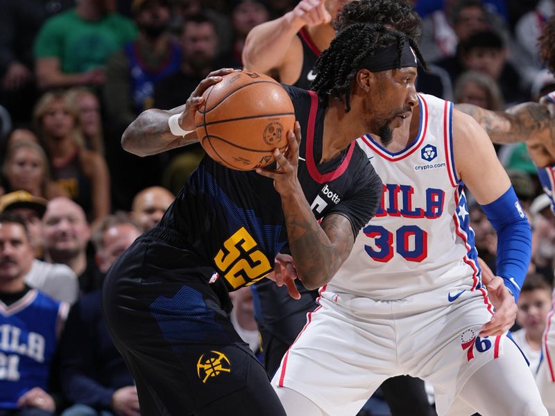 DENVER, CO - JANUARY 27: Kentavious Caldwell-Pope #5 of the Denver Nuggets looks to pass the ball during the game against the Philadelphia 76ers on January 27, 2024 at the Ball Arena in Denver, Colorado. NOTE TO USER: User expressly acknowledges and agrees that, by downloading and/or using this Photograph, user is consenting to the terms and conditions of the Getty Images License Agreement. Mandatory Copyright Notice: Copyright 2024 NBAE (Photo by Garrett Ellwood/NBAE via Getty Images)