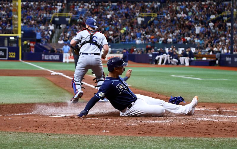 May 27, 2023; St. Petersburg, Florida, USA;  Tampa Bay Rays catcher Christian Bethancourt (14) scores a run during the fourth inning against the Los Angeles Dodgers at Tropicana Field. Mandatory Credit: Kim Klement-USA TODAY Sports