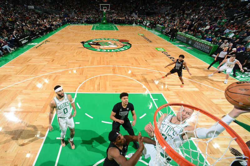 BOSTON, MA - FEBRUARY 14: Kristaps Porzingis #8 of the Boston Celtics drives to the basket during the game against the Brooklyn Nets on February 14, 2024 at the TD Garden in Boston, Massachusetts. NOTE TO USER: User expressly acknowledges and agrees that, by downloading and or using this photograph, User is consenting to the terms and conditions of the Getty Images License Agreement. Mandatory Copyright Notice: Copyright 2024 NBAE  (Photo by Brian Babineau/NBAE via Getty Images)