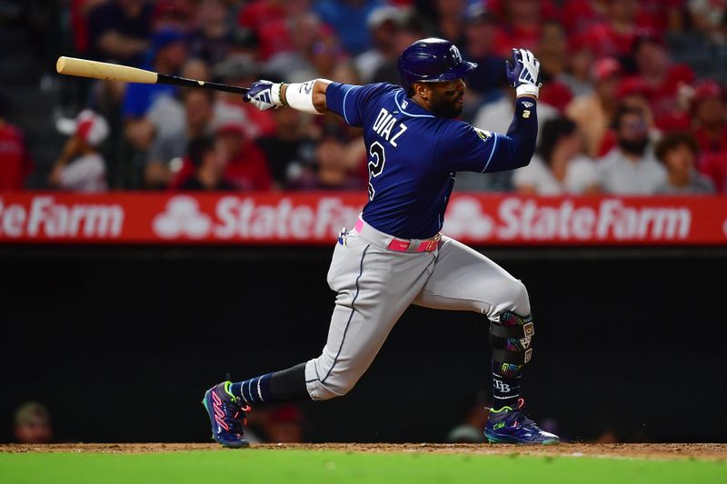 Aug 18, 2023; Anaheim, California, USA; Tampa Bay Rays first baseman Yandy Diaz (2) hits a single against the Los Angeles Angels during the seventh inning at Angel Stadium. Mandatory Credit: Gary A. Vasquez-USA TODAY Sports