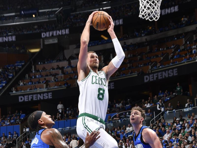 ORLANDO, FL - APRIL 27:  Kristaps Porzingis #8 of the Boston Celtics dunks the ball during the game against the Orlando Magic  during Round 1 Game 4 of the 2025 NBA Playoffs on April 27, 2025 at Kia Center in Orlando, Florida. NOTE TO USER: User expressly acknowledges and agrees that, by downloading and or using this photograph, User is consenting to the terms and conditions of the Getty Images License Agreement. Mandatory Copyright Notice: Copyright 2025 NBAE (Photo by Gary Bassing/NBAE via Getty Images)
