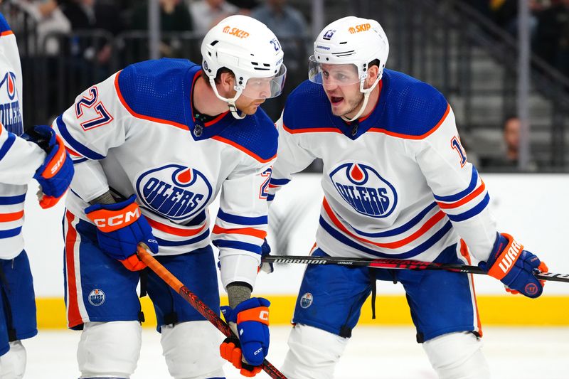 Feb 6, 2024; Las Vegas, Nevada, USA; Edmonton Oilers center Mattias Janmark (13) talks to Edmonton Oilers defenseman Brett Kulak (27) before a face off against the Vegas Golden Knights at T-Mobile Arena. Mandatory Credit: Stephen R. Sylvanie-USA TODAY Sports