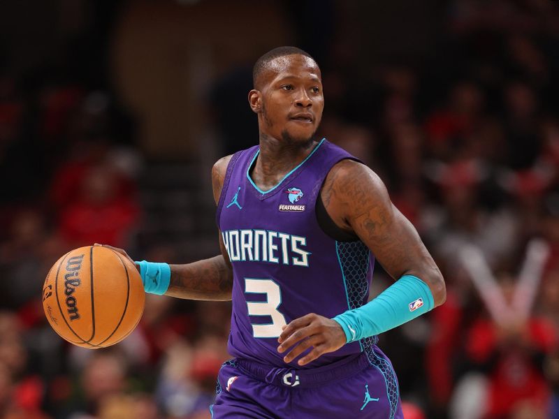 CHICAGO, ILLINOIS - DECEMBER 06: Terry Rozier #3 of the Charlotte Hornets dribbles up the court against the Chicago Bulls during the second half at the United Center on December 06, 2023 in Chicago, Illinois. NOTE TO USER: User expressly acknowledges and agrees that, by downloading and or using this photograph, User is consenting to the terms and conditions of the Getty Images License Agreement.  (Photo by Michael Reaves/Getty Images)