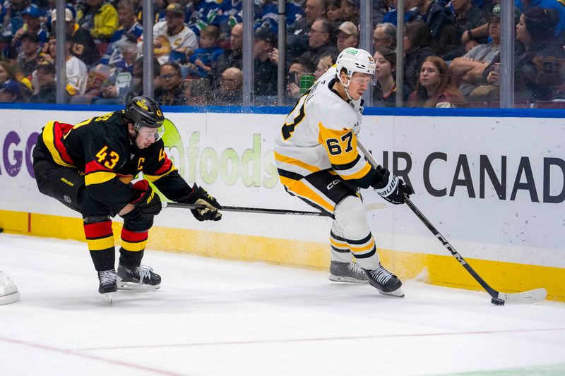 Oct 26, 2024; Vancouver, British Columbia, CAN; Vancouver Canucks defenseman Quinn Hughes (43) defends against Pittsburgh Penguins forward Rickard Rakell (67) during the second period at Rogers Arena. Mandatory Credit: Bob Frid-Imagn Images