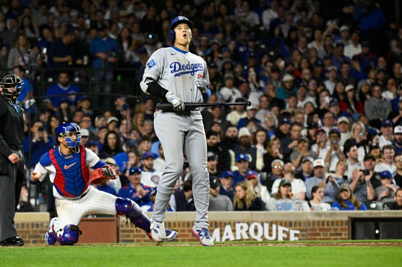 Apr 22, 2025; Chicago, Illinois, USA; Los Angeles Dodgers two-way player Shohei Ohtani (17) reacts after having a strike called on him during the seventh inning against the Chicago Cubs at Wrigley Field. Mandatory Credit: Matt Marton-Imagn Images