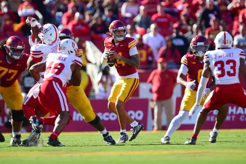 Nov 16, 2024; Los Angeles, California, USA; Southern California Trojans quarterback Jayden Maiava (14) drops back to pass against the Nebraska Cornhuskers during the first half at the Los Angeles Memorial Coliseum. Mandatory Credit: Gary A. Vasquez-Imagn Images