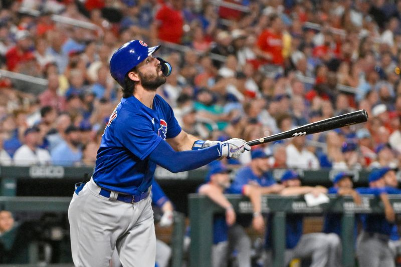 Jul 28, 2023; St. Louis, Missouri, USA;  Chicago Cubs shortstop Dansby Swanson (7) hits one run sacrifice fly against the St. Louis Cardinals during the sixth inning at Busch Stadium. Mandatory Credit: Jeff Curry-USA TODAY Sports