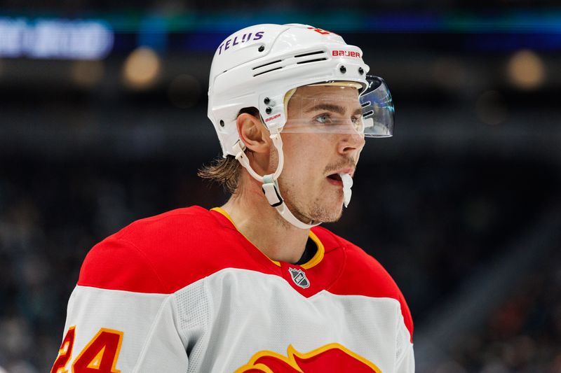 Oct 19, 2024; Seattle, Washington, USA; Calgary Flames defenseman Jake Bean (24) looks on against the Seattle Kraken during the third period at Climate Pledge Arena. Mandatory Credit: Caean Couto-Imagn Images