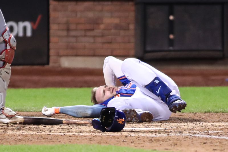 Aug 26, 2023; New York City, New York, USA;  New York Mets first baseman Pete Alonso (20) lays on the ground after getting hit by a pitch in the eighth inning against the Los Angeles Angels at Citi Field. Mandatory Credit: Wendell Cruz-USA TODAY Sports