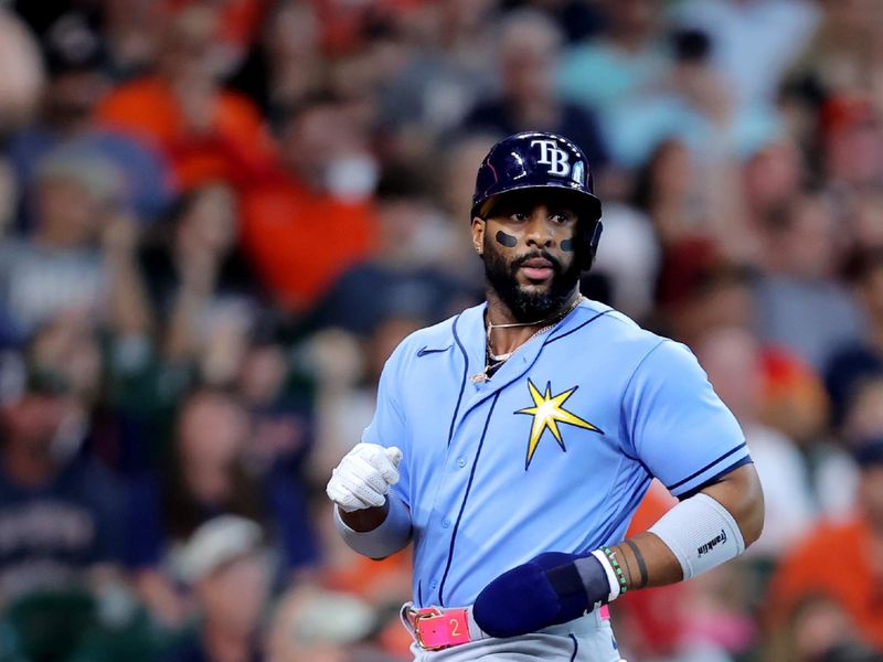 Jul 30, 2023; Houston, Texas, USA; Tampa Bay Rays first baseman Yandy Diaz (2) crosses home plate to score a run against the Houston Astros during the first inning at Minute Maid Park. Mandatory Credit: Erik Williams-USA TODAY Sports