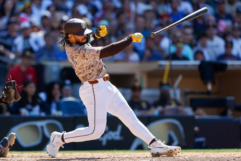 May 26, 2024; San Diego, California, USA;  San Diego Padres catcher Luis Campusano (12) loses his bat as it flys towards the New York Yankees dugout in the seventh inning at Petco Park. Mandatory Credit: David Frerker-USA TODAY Sports